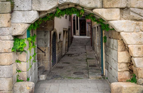 Photo of Postigo do Carvao, the only remaining gate in the 14th century Fernandine Walls around the city of Porto near Ribeira square and the Douro River.