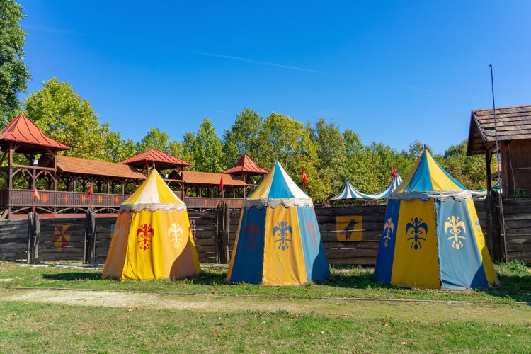 Photo of Colorful medieval knight age tents in sümeg castle knight game joust decoration.