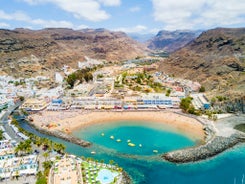 photo of landscape with Maspalomas town and golden sand dunes at sunrise, Gran Canaria, Canary Islands, Spain.