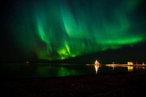 photo of Northern Lights over Nallikari Beach in Oulu, Finland.