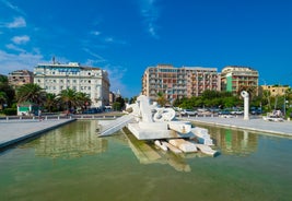 Photo of beautiful view of canal with statues on square Prato della Valle and Basilica Santa Giustina in Padova (Padua), Veneto, Italy.