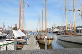 Photo of aerial view of the city of Bremerhaven with the harbor and traditional sailing-ships, Germany.