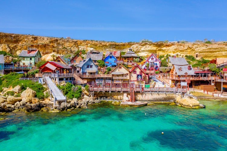 Photo of the famous village Mellieha and beach on a sunny day.