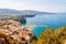 photo of aerial panorama of high cliffs, Tyrrhenian Sea Bay with pure azure water, floating boats and ships, pebble beaches, rocky surroundings of Meta in Sant'Agnello and Sorrento cities near Naples region in Italy.