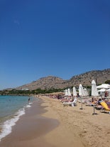 Photo of panoramic aerial view of Lindos bay, village and Acropolis, Rhodes, Greece.