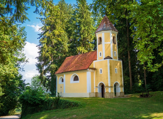 Photo of Small church in front of the castle of Mokrice, Slovenia.