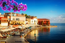 Photo of aerial view of Chania with the amazing lighthouse, mosque, venetian shipyards, Crete, Greece.