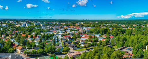 Early autumn morning panorama of the Port of Turku, Finland, with Turku Castle at background.