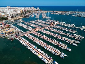 photo of aerial panoramic drone point of view Cabo Roig coastline with blue Mediterranean Seascape view, residential buildings near sandy beach at sunny summer day. Province of Alicante, Costa Blanca. Spain.