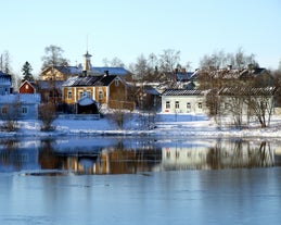 Early autumn morning panorama of the Port of Turku, Finland, with Turku Castle at background.