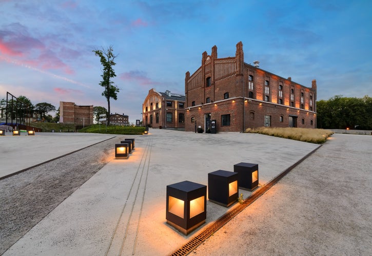 The former coal mine "Katowice", seat of the Silesian Museum. The complex combines old mining buildings and infrastructure with modern architecture. Poland. Europe. in the evening.