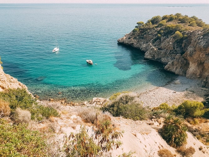 Crystal clear waters of Las Rotas beach in Denia