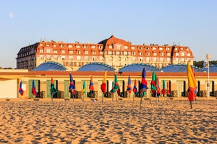 photo of Port of Deauville and city skyline in a sunny summer day, Normandy, France.