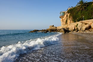 Photo of aerial view of beach in Nerja, Malaga province, Costa del Sol, Andalusia, Spain.