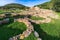 photo of view of Nuragic complex of Palmavera, archaeological site with stone ruins of a Nuragic settlement from the Bronze Age, Porto Conte, Alghero, Maristella, Italy.