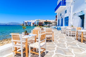 Photo of beautifull view over Mykonos from the sky with drone at the whitewashed village Greece.