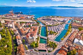 photo of aerial panoramic view of beautiful town of Lovran and sea walkway in Croatia.