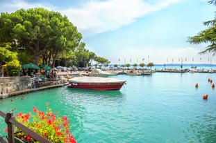 Photo of beautiful view of canal with statues on square Prato della Valle and Basilica Santa Giustina in Padova (Padua), Veneto, Italy.