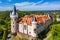 Photo of aerial view of Zleby castle in Central Bohemian region, Czech Republic. The original Zleby castle was rebuilt in Neo-Gothic style of the chateau.