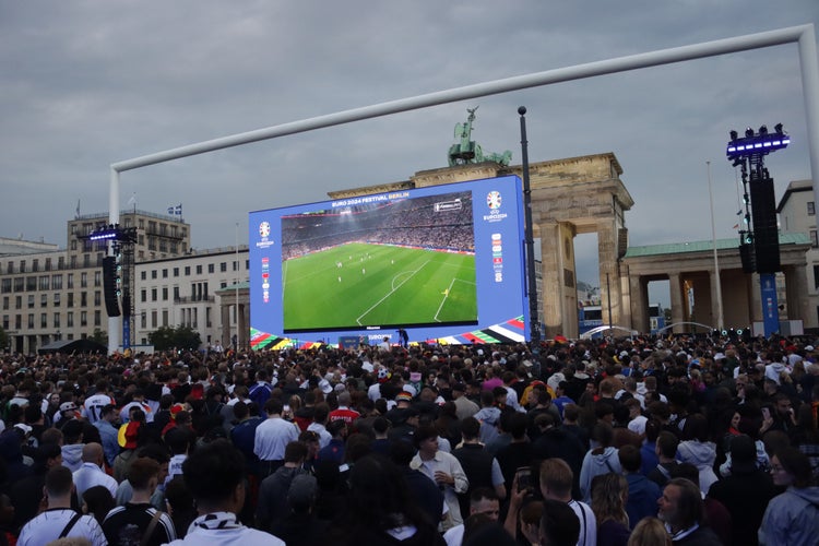 A crowd gathered in front of the Brandenburg Gate to watch the opening match between Germany vs Scotland.jpg