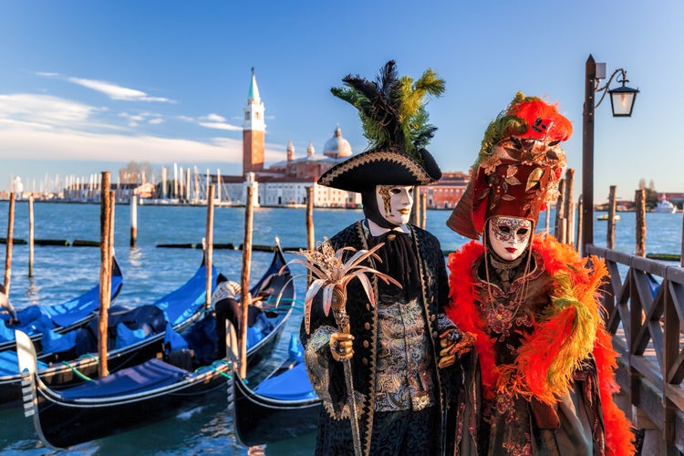 Colorful carnival masks at a traditional festival in Venice, Italy.