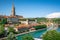 photo of aerial view of scenic Bern old town cityscape with old buildings Bern Minster cathedral tower and Aare River view in Bern Switzerland