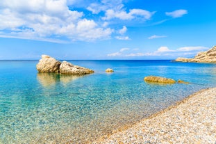 Photo of traditional colourful Greek fishing boats in Pythagorion port, Samos island, Greece.