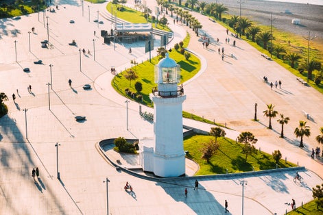 Photo of Batumi lighthouse on the Batumi Seafront Promenade on a sunny day, Georgia.