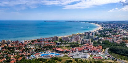 Photo of panoramic aerial view over small ancient resort town of Pomorie with old European small houses , Bulgaria.