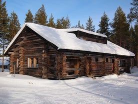 photo of beautiful white winter of frozen lake, mountain at Ylläs Lapland, Finland.