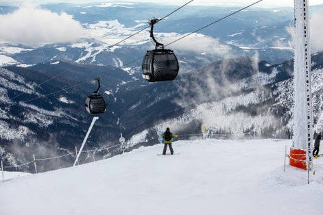 Photo of snowboarder at the slope of chopok mountain in slovakia copy space.