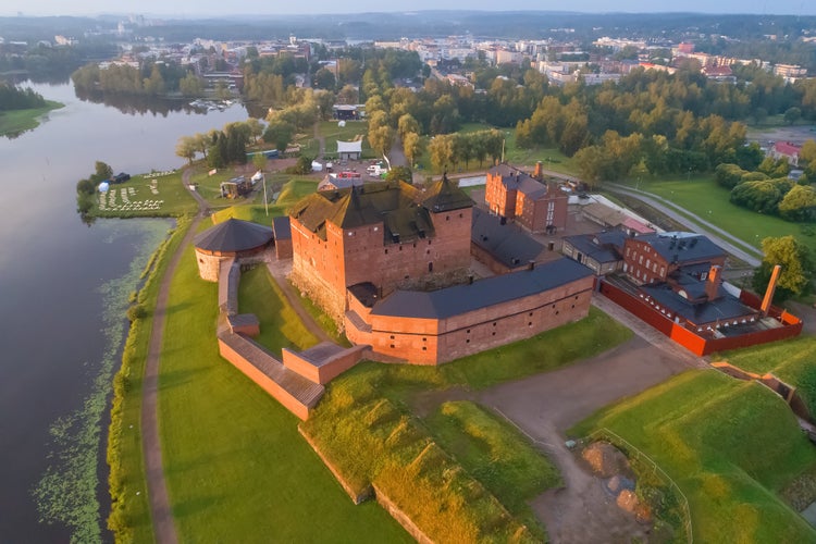 photo of view of Ancient fortress in a cityscape in the early July morning (aerial photography). Hameenlinna, Finland.