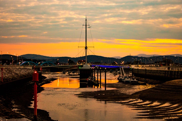 photo of Rhyl harbour bridge at sunset in Wales.