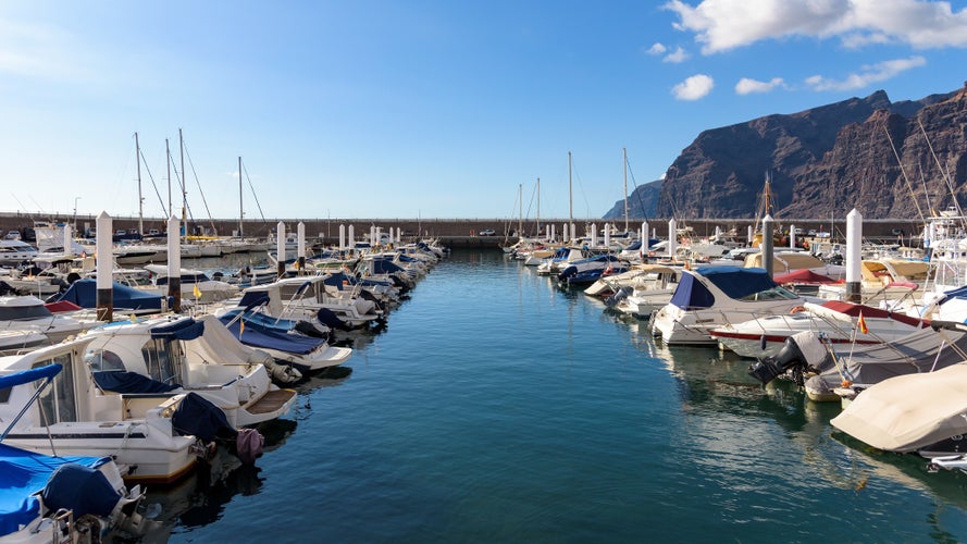 Photo of Motorboats and yachts moored at port in Los Gigantes on Tenerife, Canary Islands, Spain.