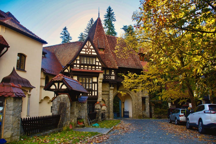 Photo of Peles Castle beautiful famous royal castle and ornamental garden in Sinaia landmark of Carpathian Mountains, Romania.