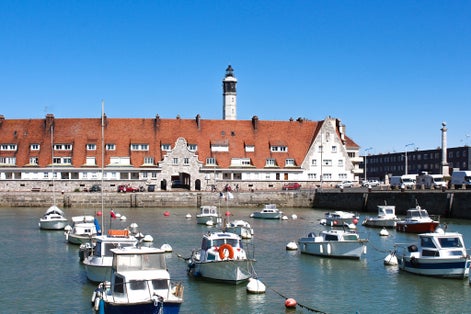 Calais lighthouse and port wharf in the north of France