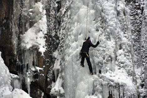 photo of view of Ice climber climbing on the frozen Boyana Waterfall in Vitosha Mountain near Sofia City, Bulgaria,Sofia bulgaria.