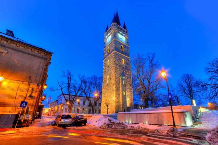 photo of view of Beautiful winter scene in Baia Mare city, with illuminated architecture in downtown, at night, Romania