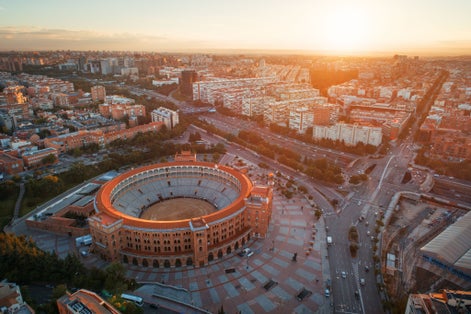 Photo of Madrid Plaza de Toros de Las Ventas (Las Ventas Bullring) aerial view with historical buildings in Spain.