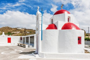 Photo of panoramic aerial view of the popular Platis Gialos beach on the Greek island of Mykonos with turquoise sea, Greece.