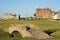 Photo of The famous Swilcan bridge on the 18th hole of the Old Course links in St Andrews, Scotland.