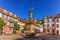 photo of view of The Madonna statue in Kornmarkt square and castle in Heidelberg by day, Germany.