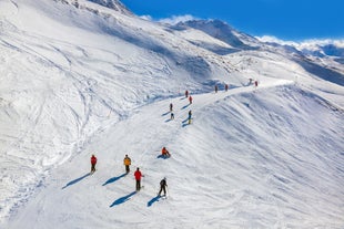 Photo of The mountain village at the Austrian ski resort Soelden on a cold and sunny winter day.