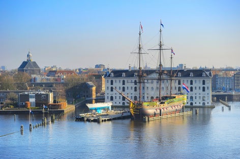photo of skyline of Amsterdam with National Maritime Museum on the foreground. Netherlands.