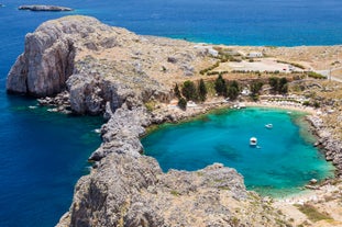 Photo of panoramic aerial view of Lindos bay, village and Acropolis, Rhodes, Greece.