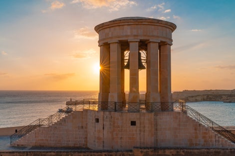Photo of the Lower Barrakka Gardens at sunset in Valletta, Malta.