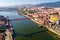 Photo of aerial view of Vizcaya bridge over the river and cityscape at Portugalete, Spain.