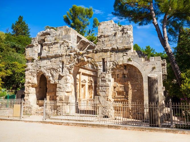 photo of view of Diana temple is an ancient roman temple in Les Jardins de la Fontaine public park in Nimes city in southern France