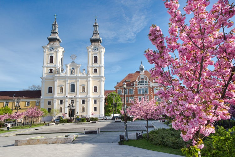 photo of view of A church and a grammar school at the Heroes Square in Miskolc, Hungary, Central Europe.