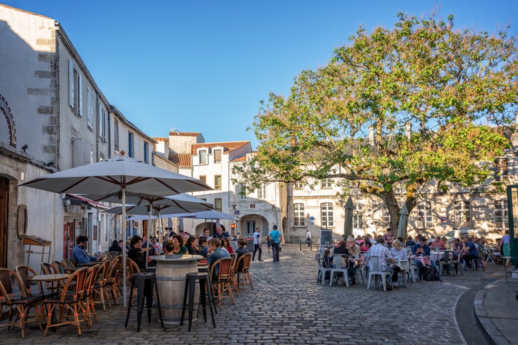 Tourists eating outdoor at restaurants in France.jpg